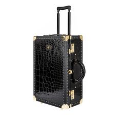 a black and gold suitcase on wheels with handles, in front of a white background