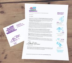 two letterheads are sitting on top of some white paper with blue and purple ink