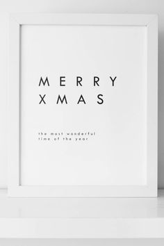 a white frame with the words merry xmas on it