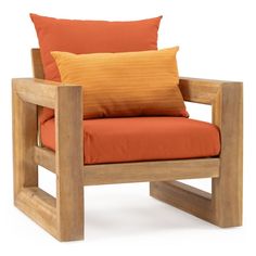 a wooden chair with orange pillows on it