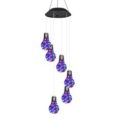 a multi - colored light bulb hanging from a black ceiling fixture with five different lights