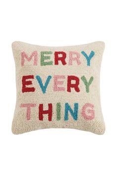 a pillow that says merry every thing on the front and back, in multicolored letters