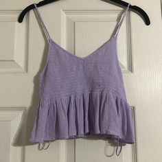 This Top Is The Ultimate Girly Cute Top. The Tight Top With The Flowy Bottom Is Soooo Flattering On Any And All Body Types!! Trust Me You Will Love This Pick For You Or Your Daughter. -Adjustable Straps (Seen In Last Pic) -New With Tags -100% Viscos Trendy Purple Top With Spaghetti Straps, Trendy Purple Spaghetti Strap Top, Purple Cotton Spaghetti Strap Tops, Casual Purple Camisole Top, Casual Purple Spaghetti Strap Top, Purple Top With Adjustable Straps For Summer, Spaghetti Strap Top, Strap Top, Cute Top