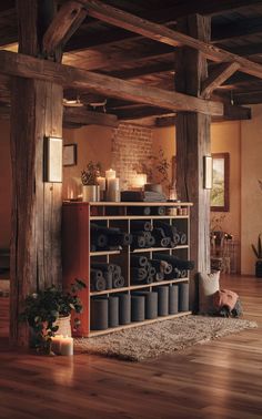 A rustic yoga studio with cozy, organized yoga mat storage. Mat Storage Ideas, Yoga Storage Ideas, Yoga Studio Design Ideas, Cozy Yoga, Yoga Storage, Yoga Room Design, Gear Room, Yoga Mat Storage, Earthy Living Room