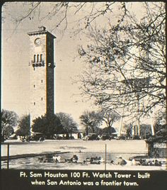 an old black and white photo of a tall tower with a clock on it's side