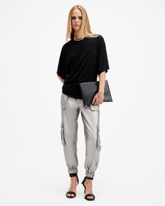 Cargo pants are so 90s, and we love it. Add a pair to your rotation - these are the Freda. Crafted from a metallic coated fabric and shaped to a regular silhouette with a tapered, cuffed leg. Pocket detailing on the legs completes the laidback aesthetic.  These pants are designed to a regular fit High-rise Zip closure Two front pockets Two side pockets Elasticated cuffs Tapered slim leg Laidback Aesthetic, Coated Denim, Loungewear Outfits, Denim Cargo, Pants And Leggings, Cargo Pants Women, Sweater Sale, Sweaters And Jeans, Cargo Trousers