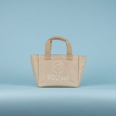 A High Quality, Lightweight Yet Durable Mini Tote Bag by WOLFpak. This Tote Bag Is Extremely Practical For The Office, Gym, Beach and More! 10L Tote Bag 10.5in (27cm) W x 9in (23cm) H x 5.5in (14cm) D Waterproof Surface Oxford 1000D Polyester Dual Exterior Side Pockets Hand Carrying Straps or Over the Shoulder Branded Embroidery Logo Molle Webbing Easy Clean Polyurethane Lining Protective Inside Computer Sleeve 10in x 6in (Fits Small Tablet) Inside Zipper Pocket (2) Mesh Card Pockets Beige Shoulder Bag With Reinforced Handles, Beige Tote Bag For Outdoor, Practical Beige Tote Bag, Practical Beige Bag For Daily Use, Beige Bags With Reinforced Handles, Beige Everyday Bags With Reinforced Handles, Beige Outdoor Bag With Removable Pouch, Everyday Beige Bags With Reinforced Handles, Beige Medium Shoulder Bag For Daily Use