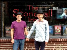 two men holding hands in front of a store window with the caption did you know that marvel professor x and magneto have a gay relationship?