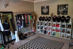 a closet filled with lots of different types of shoes and jewelry hanging on the wall