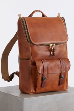 American made and built to last, this ruggedly handsome leather backpack carries all your essentials and so much more. Crafted from heirloom-quality Horween leather, this durable carryall has a double-zip top flap with roomy interior featuring a snap-over slide pocket measuring 9"x11"; an inner zip pocket; and four pouches for pens, cell phones, and sunglasses. Exterior details include a rear locking concealed carry pocket, a front pouch with double leather-strap closure and turning clasps, a si Rugged Leather Bag With Zipper Pocket, Brown Backpack With Zipper For Everyday Carry, Brown Leather Backpack With Zipper For Everyday, Outdoor Leather Backpack With Zipper Closure, Leather Backpack For Everyday Carry, Leather Backpack With Zipper Pocket, Leather Backpack With Zipper For Everyday Carry, Horween Leather, Leather Sling Bag