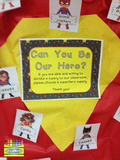 a bulletin board that has been decorated with stickers and paper on it, which says can you be our hero?