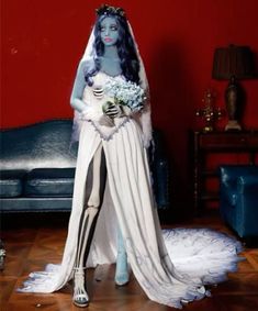 a corpse bride is standing in front of a couch