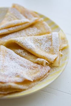 some powdered food on a yellow and white plate