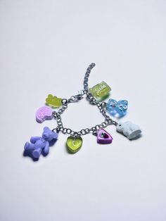 The Three Bears Bracelet 🐰 Add a touch of fun and whimsy to your look with this kitsch chunky silver charm bracelet! This bracelet features a variety of brightly colored charms, including bears, hearts, bunnies, cookies, and cake. The charms are all different shapes and sizes, and they are arranged in a random order, which creates a fun and playful look. 🧸 Only one available as I like to make one of a kind pieces so that you have a unique, standout, rare, special piece that you can't find anywhere else. Keep your jewellery away from water, oils, perfumes and make sure to remove before showering and sleeping in order to keep it in it's best condition. Sphider Design Cute, Quirky, Girly, Coquette, Unique, Y2K, Fairycore, Twee, Handmade Playful Handmade Silver Charm Bracelet, Cute Silver Charm Bracelet For Party, Playful Silver Charm Bracelet As Gift, Playful Silver Charm Bracelet For Gift, Playful Nickel-free Silver Bracelets, Playful Silver Charm Bracelet Perfect As A Gift, Playful Silver Nickel-free Bracelets, Playful Handmade Silver Bracelets, Playful Silver Bracelets For Gifts