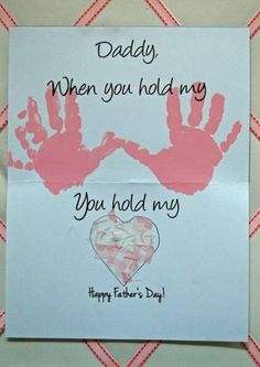 a father's day card with two handprints and a heart on it