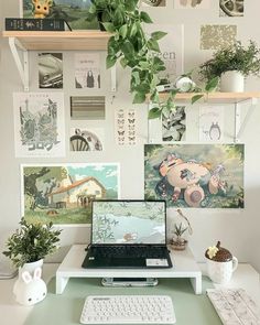 a laptop computer sitting on top of a white desk next to a keyboard and mouse