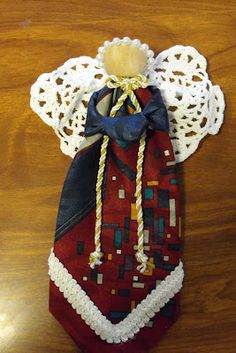 an ornament made to look like a red and white christmas stocking on a wooden table