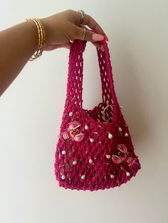 A hot pink woven bag with inner lining to protect your belongings. Hand embroidered with beaded pink lobster appliqué, pearls and colourful gold charms. Trendy Pink Shoulder Bag With Pearl Handle, Summer Pink Beaded Bag, Summer Pink Beaded Shoulder Bag, Trendy Pink Bag With Pearl Handle, Trendy Pink Embroidered Bag, Pink Embroidered Shoulder Bag For Shopping, Pink Embroidered Beach Bag, Pink Rectangular Shoulder Bag With Pearl Handle, Pink Beaded Bag For Everyday Use