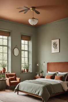 a bed sitting in a bedroom next to two windows with potted plants on them