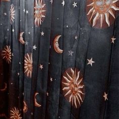 the curtain has sun and moon designs on it