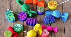 several colorful candy lollipops on a wooden table