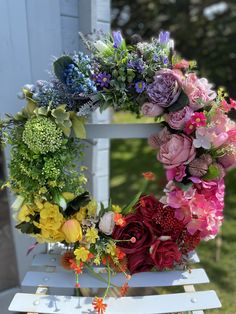 a white chair with flowers on it