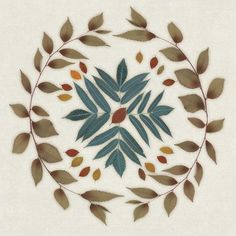 a circular design with leaves in the center