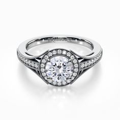 a white gold engagement ring with diamonds on it