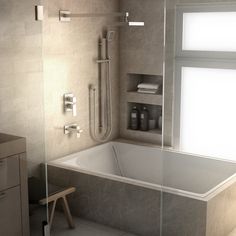 a bathroom with a tub, shower head and window