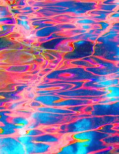 an abstract image of colorful water ripples