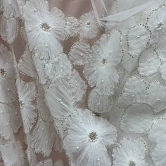 Make a statement with amazing, beaded 3D lace fabric! This luxurious fabric is perfect for creating high-end pieces for any special occasion. Our exquisite 100% polyester net mesh is intricately embroidered with a beautiful, beaded 3D floral design, making it a stunning choice for couture 3D bridal lace, evening dress 3D lace, quinceanera dress 3D lace, dance costume 3D lace and any other fabulous special occasion piece. Perfect for adding a couture touch to your look, this beaded 3D lace fabric Elegant Embroidered Fabric With Floral Applique For Party, Elegant Lace Fabric With 3d Embroidery, Elegant Floral Embellished Lace Fabric, Elegant Organza Fabric With 3d Embroidery, White Pearl Embroidered Fabric For Party, Elegant Tulle Fabric With 3d Lace Embroidery, Elegant Lace Tulle Fabric With 3d Embroidery, Elegant Cream Embroidered Fabric With 3d Embroidery, Elegant Organza Fabric For Wedding