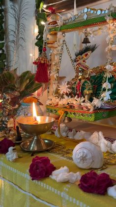 an elaborately decorated table with candles and decorations