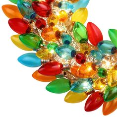 a multi - colored chandelier hanging from the ceiling with many lights on it