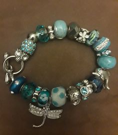 One of a kind Charm Bracelets by AmyBedazzled jewelry line. You can either buy them as is, or they can made to order by color (s) and by the type of charm (s) you want. They come in size small (7.5 inches), med (8 inches) and large (8.5 inches), and X large (9 inches). Add some dazzle to your life! Attention Philly and South Jersey residents! To avoid shipping costs I can sell my jewelry face to face. Let me know the place and the time. Turquoise Beaded Bracelets With Charms As Gift, Blue Charm Bracelet With Dangling Charms As Gift, Blue Friendship Bracelets With Charms, Blue Dangle Bracelets With Charms, Blue Beaded Bracelets With Charms For Gifts, Blue Charm Bracelets For Jewelry Making, Short Shag, Pandora Beads, South Jersey