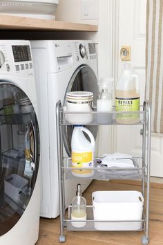 a washer and dryer sitting next to each other in front of a washing machine