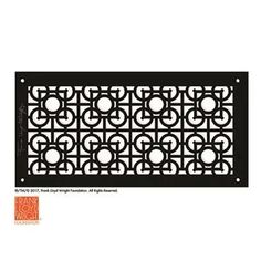 a decorative iron grille with circles in the center and an orange tag attached to it