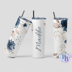 two white tumblers with blue and gold flowers on them, one has the name brooke