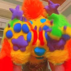 a man in a colorful costume with his hands on his hips