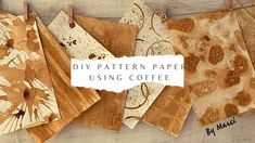 several pieces of paper hanging on clothes pins with the words diy pattern paper using coffee