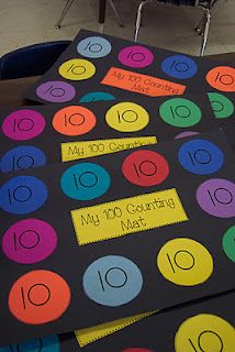 the table is set up with different colored numbers and place cards on it for counting