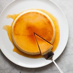 a pancake on a white plate with a fork