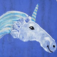 a drawing of a unicorn's head on purple paper