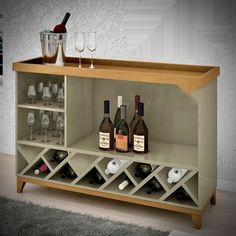 there is a wine cabinet with bottles and glasses on it