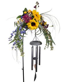 a wind chime with sunflowers and other flowers on it's side