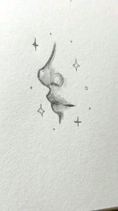 an ink drawing of a woman's face with stars on it