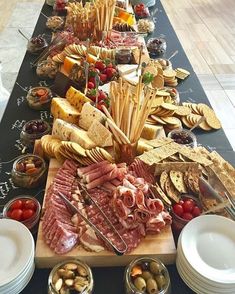 a long table filled with different types of food and snacks on it's sides