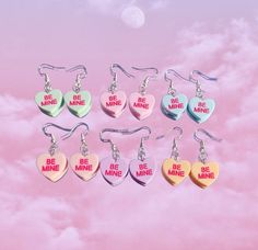 "Our \"Sweetheart\" Earrings!  These multi-colored candy heart earrings are the perfect complement to any outfit for a pop of color! Gift them to yourself, a lover or a friend ❤️🔥 1\" drop length. Fast shipping & hypoallergenic sterling silver plated earring hooks!" Lovecore Fashion, Vday Gifts, Be Mine, Heart Candy, Earring Hooks, Heart Earrings, Earring Gifts, Jewelry Earrings Dangle, Gift For Her