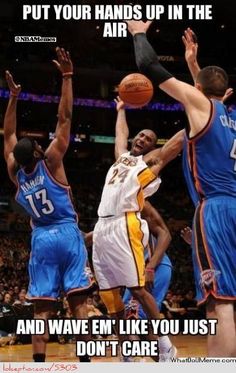 two basketball players trying to block the ball from being blocked by another player and saying, put your hands up in the air and wave'em'like you just don't care