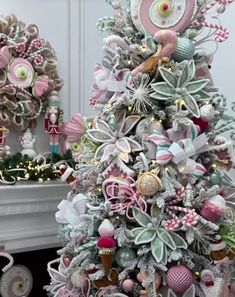 a christmas tree decorated with pink and silver ornaments