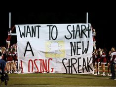 a group of cheerleaders holding up a sign that says want to start a new losing streak